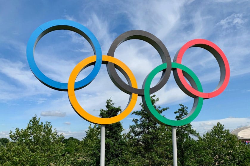 blue sky behind olympic rings
