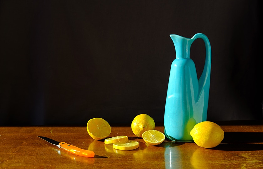 pitcher and lemons still life image